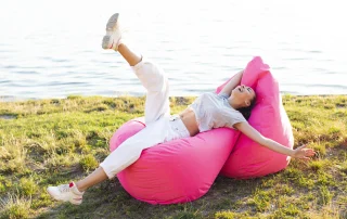 woman-having-fun-time-pink-beanbags